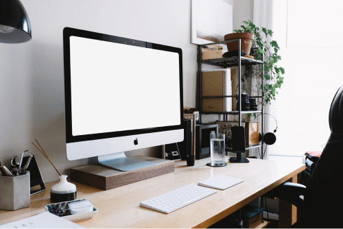 Titled Computer Mockup On A Wooden Table