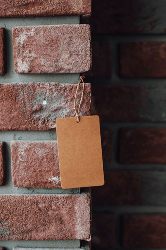 Label Tag Mockup On A Brick Wall