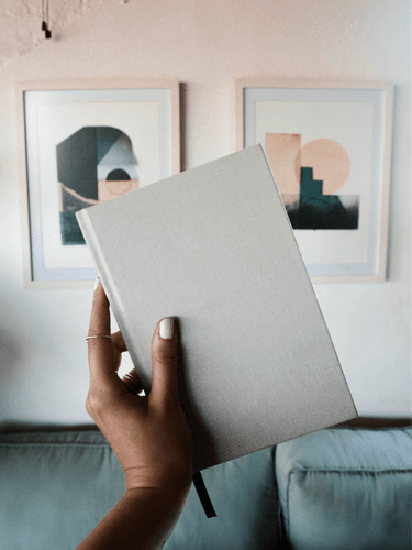 Hand Holding Journal Mockup